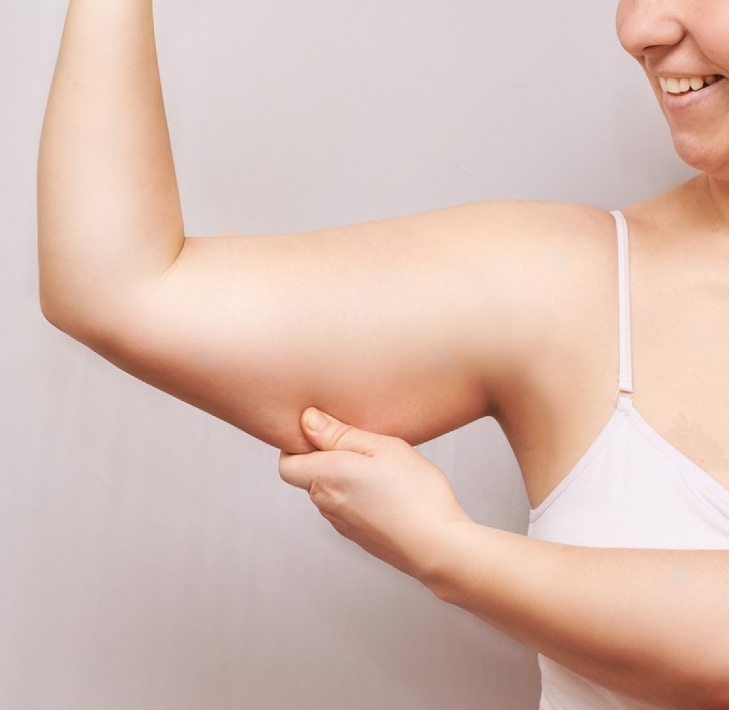 stock-photo-young-woman-pinch-fat-arm-self-hand-pinching-body-fenale-person-showing-overweight-triceps-1658336956-transformed